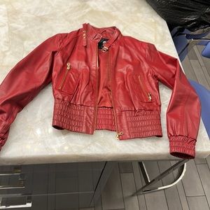 Red leather bomber with gold detail